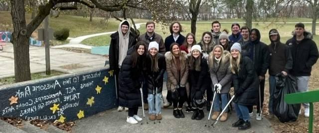 Seidman student organization members cleaning up Roosevelt Park.